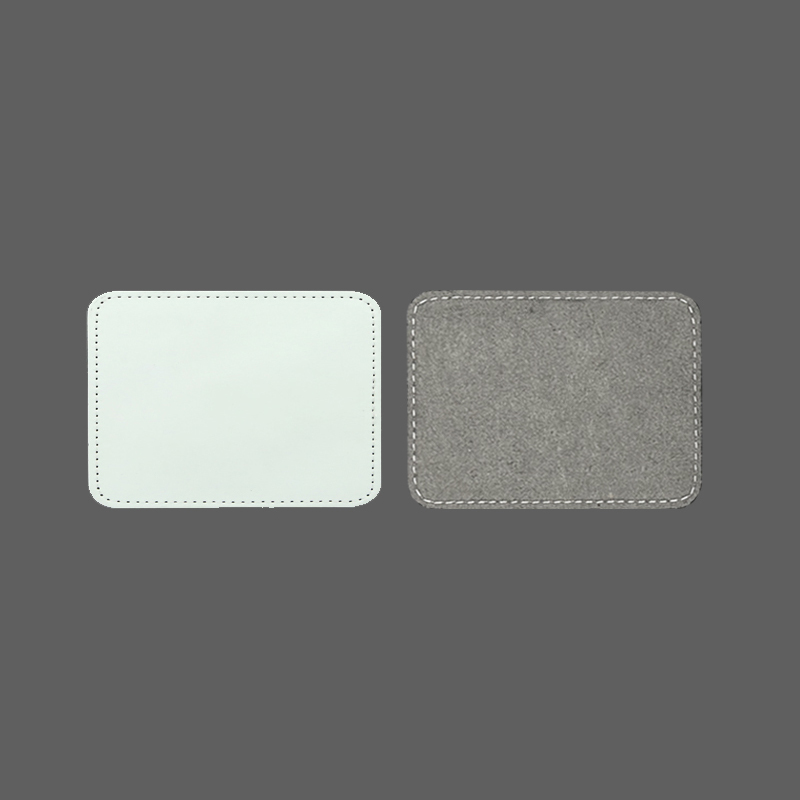 Toppe rettangolari in similpelle a sublimazione da 3 1/2' x 2 1/2' con adesivo