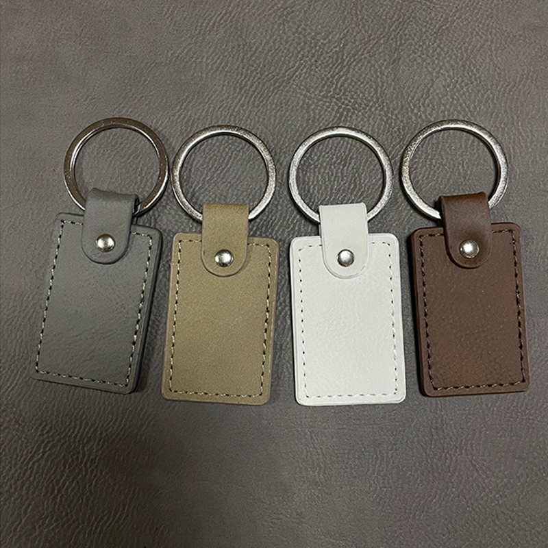 Portachiavi rettangolari in similpelle laserabili con bordo oliato Portachiavi rettangolari in similpelle laserabili con bordo oliato
